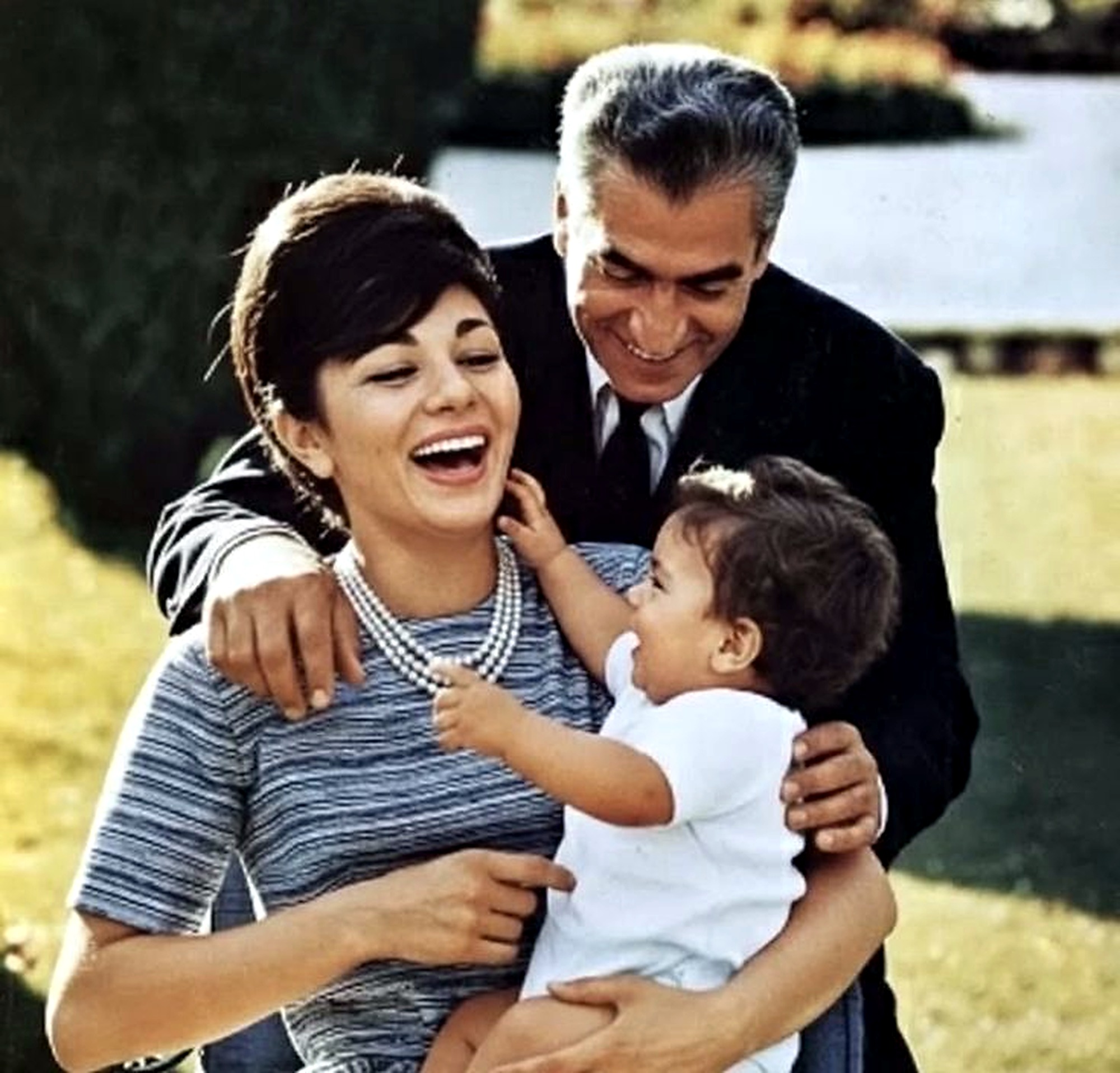Mohammad Reza Shah and Farah Pahlavi with their child.